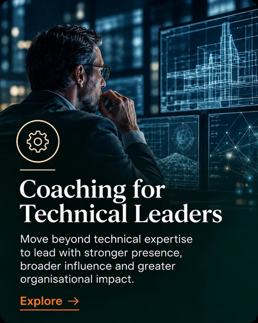 Technical leader reviewing complex digital plans and systems during leadership development coaching.