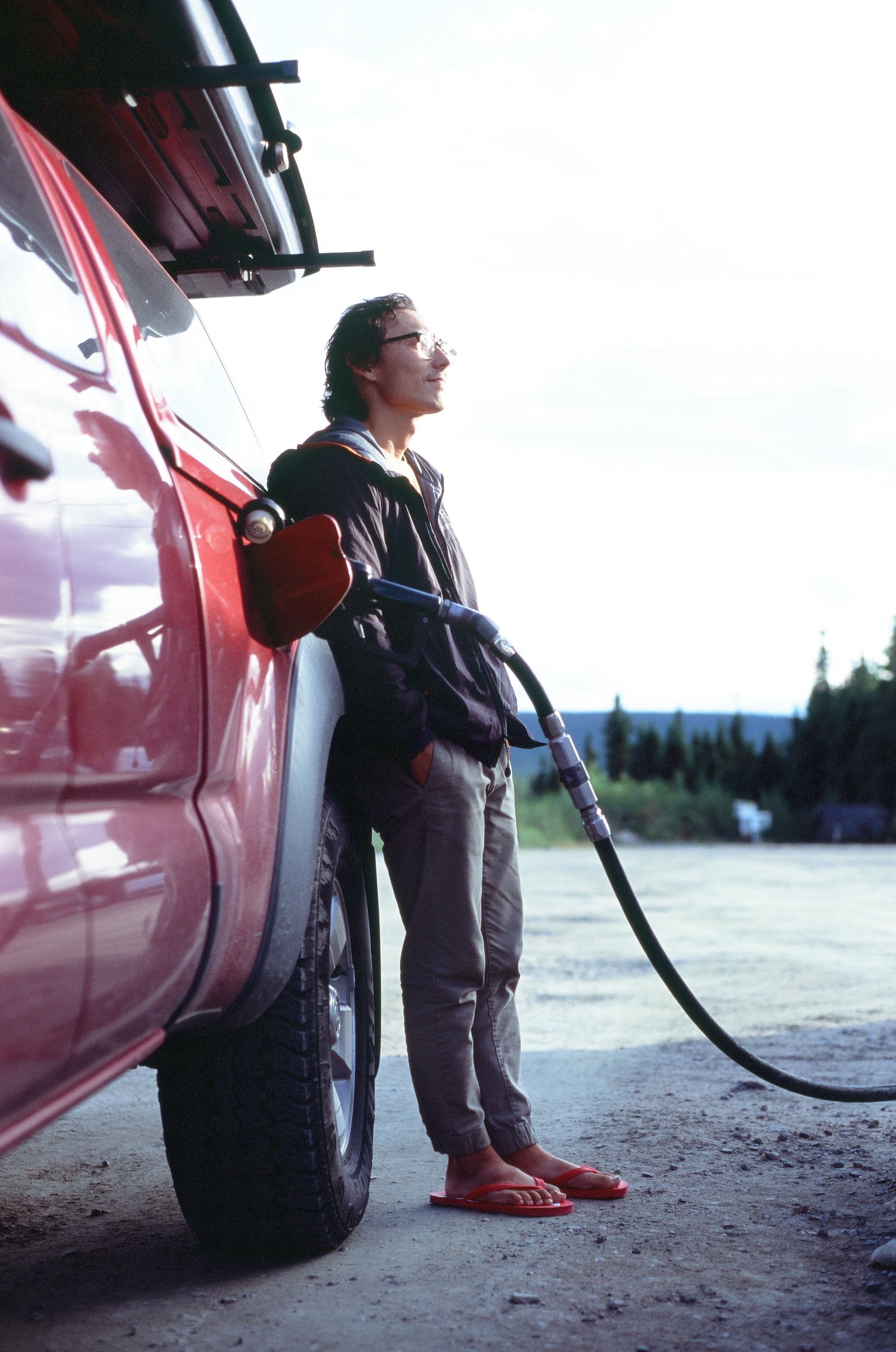  Owen filling up on gas in Churchill Falls where we paid over $7USD a gallon, 35mm 