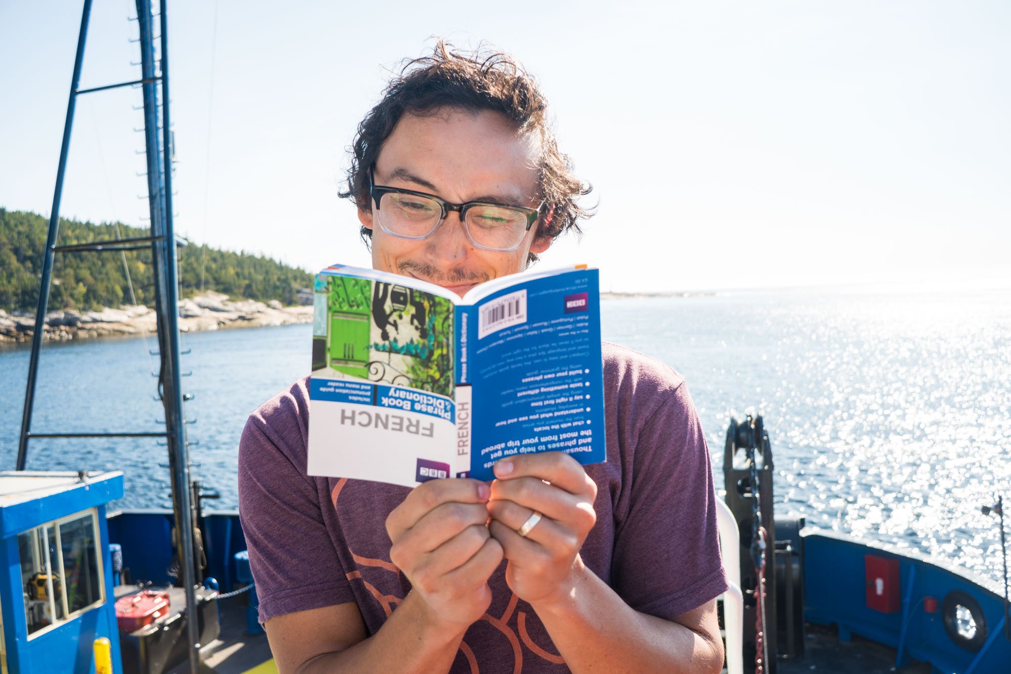  Owen practicing his French while on the ferry crossing of the Saguenay river in Tadoussac, Quebec 