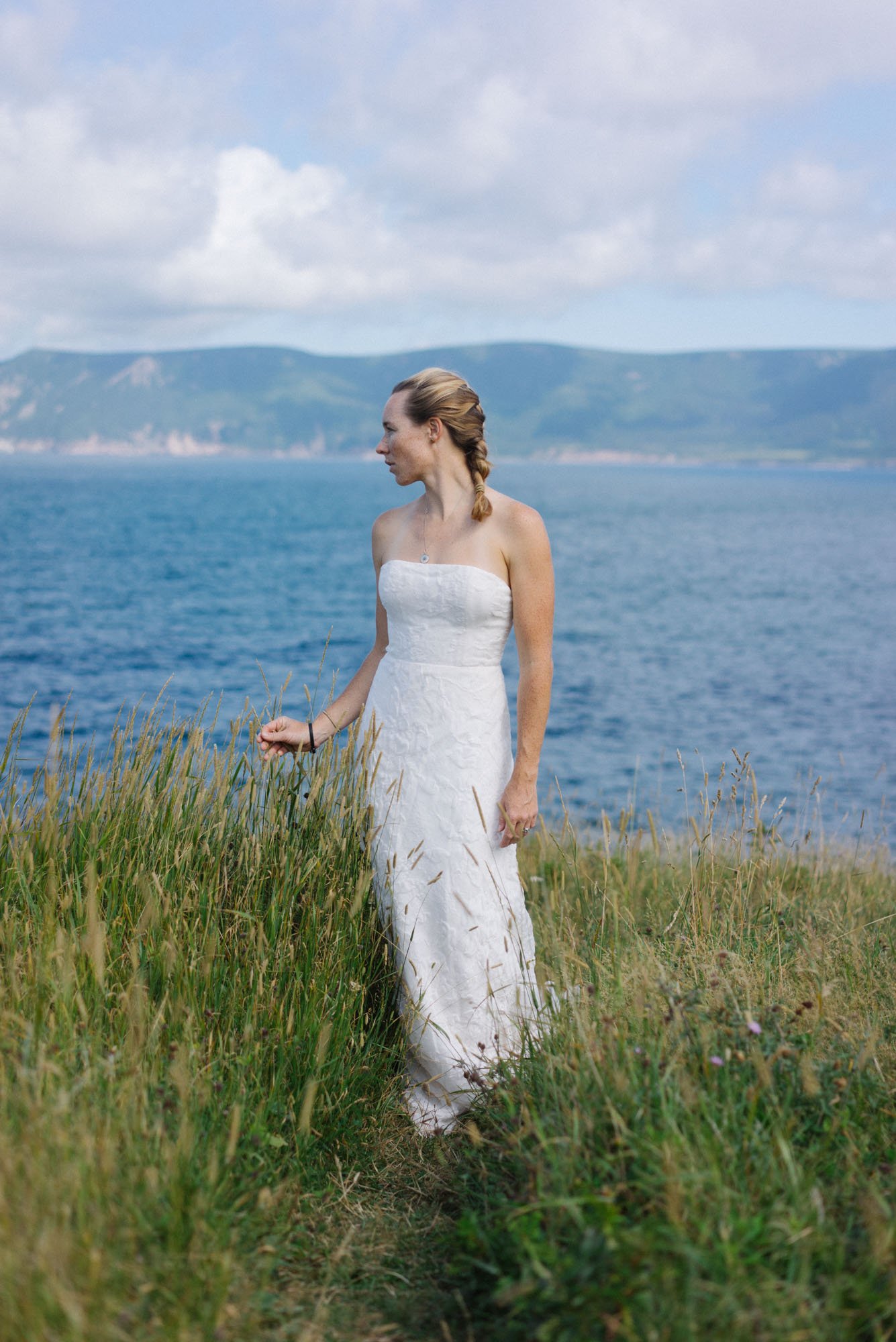  MAK modeling a   wedding dress (The Law)   on the side of the road out of Meat Cove 