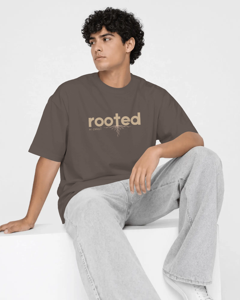 seated-men-t-shirt-mockup-curly-haired-model-resting-one-arm-on-raised-knee-looking-sideways-04514.png