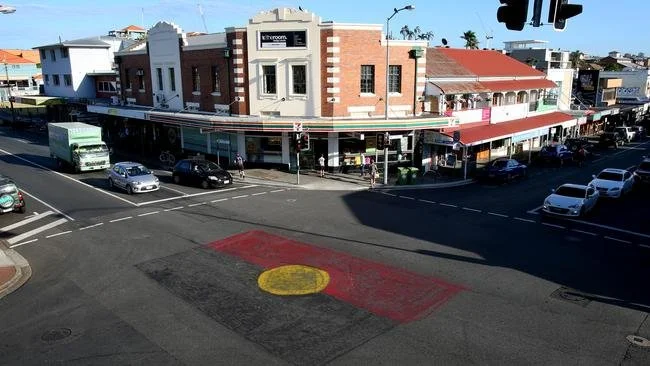 An intersection painted with the Aboriginal flag.