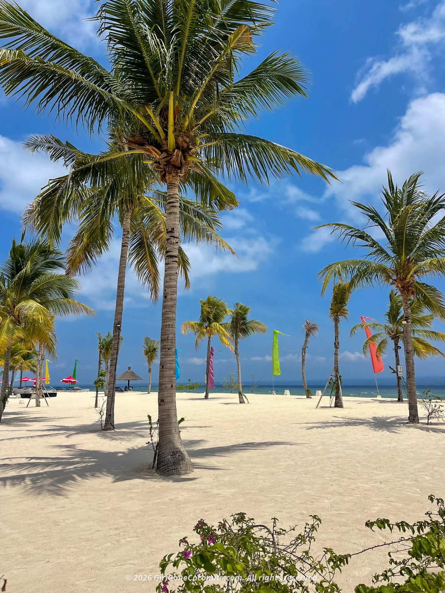 Mahagiri Beach in Nusa Lembongan with wide white sand, calm turquoise water, and distant views of Mount Agung, one of the best beaches in Nusa Lembongan.
