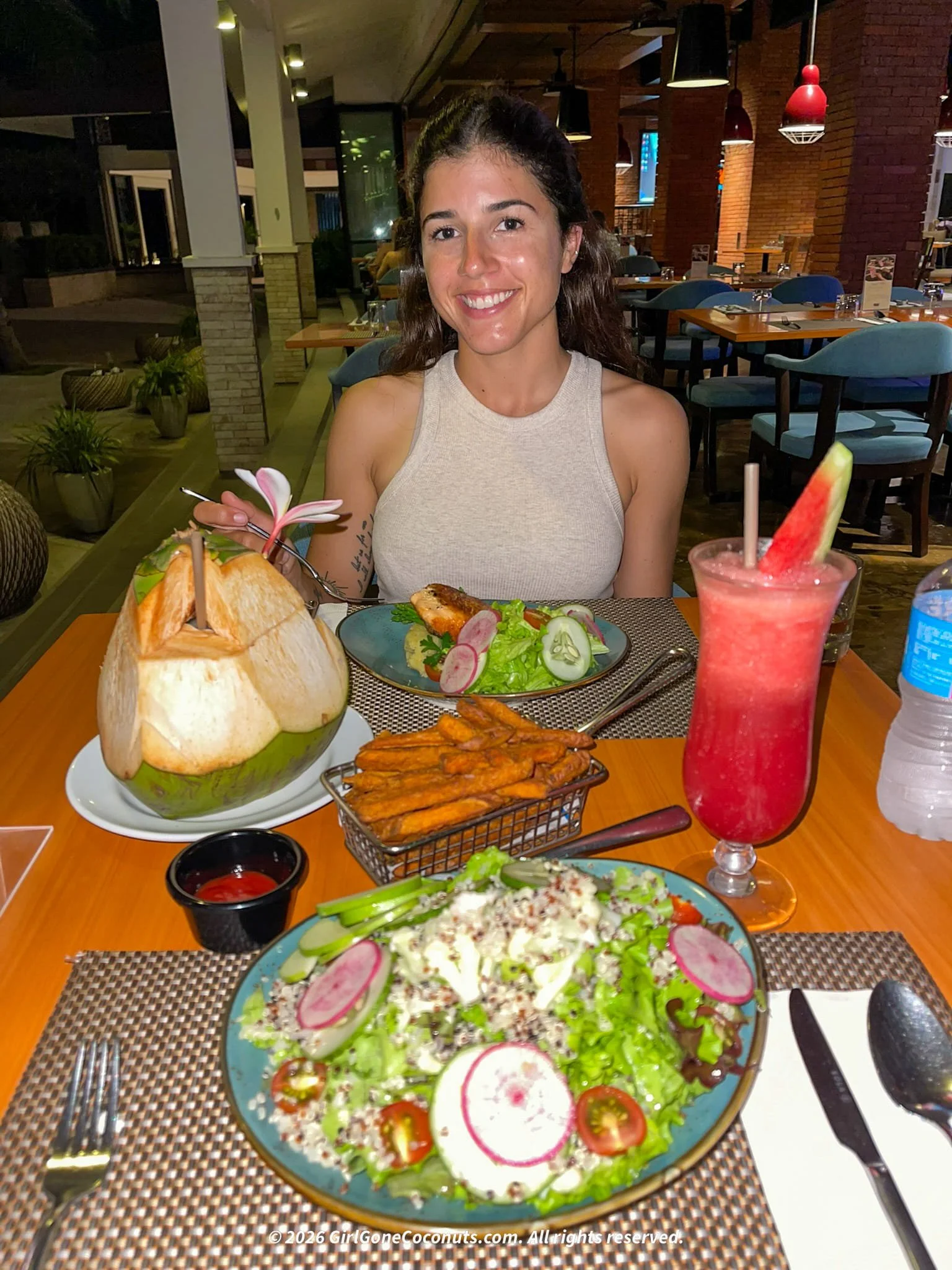 Traveler enjoying a meal at Sunset Sports Bar at Dusit Thani Mactan Cebu.