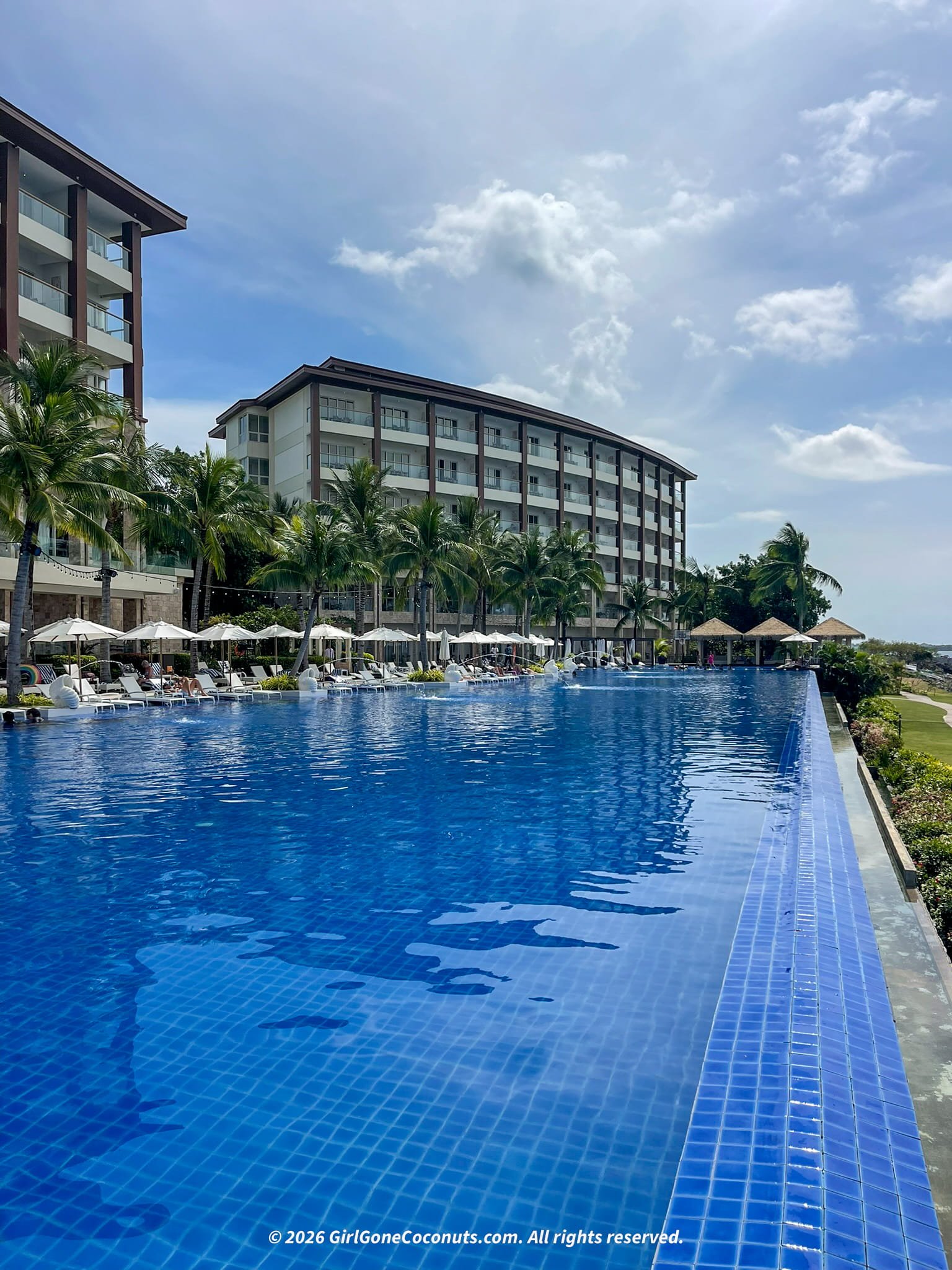 A view of Dusit Thani Mactan Hotel resort and the infinity pool overlooking the ocean.