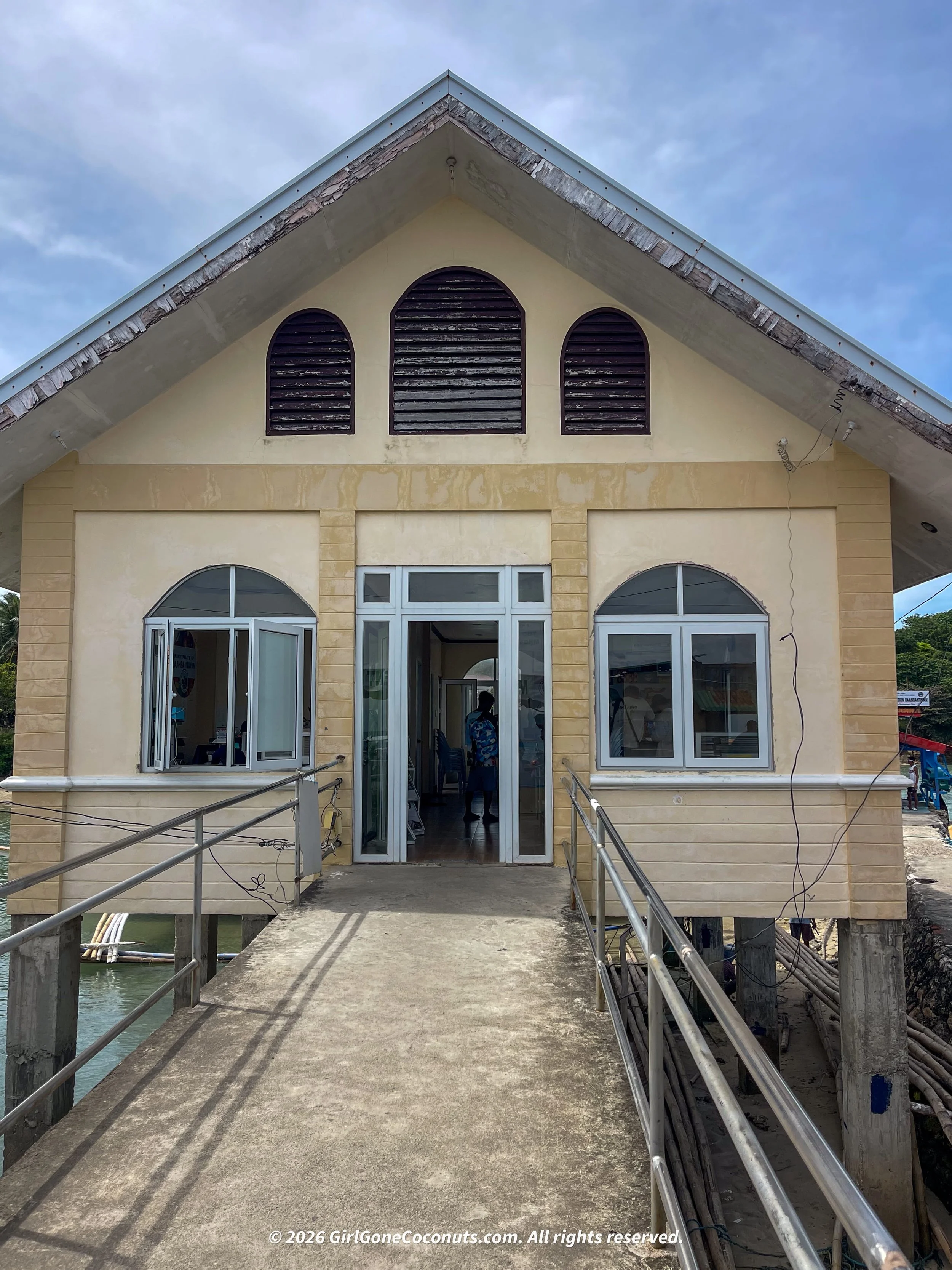 The small building where you pay the environmental fee. It also has a restroom.