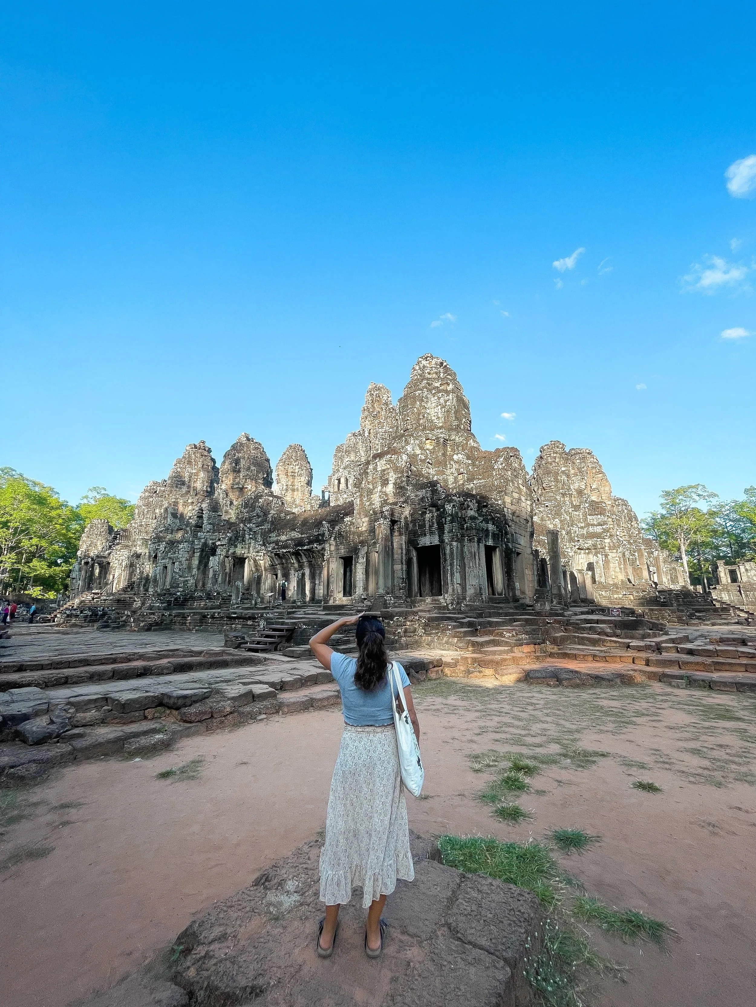 Traveler standing in front of the Angkor Wat Temple, Ta Prohm.