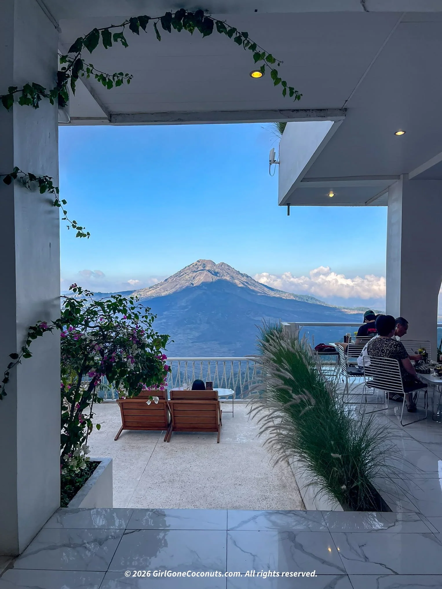 Terrace seating at Montana Del Cafe overlooking Mount Batur in Kintamani, Bali