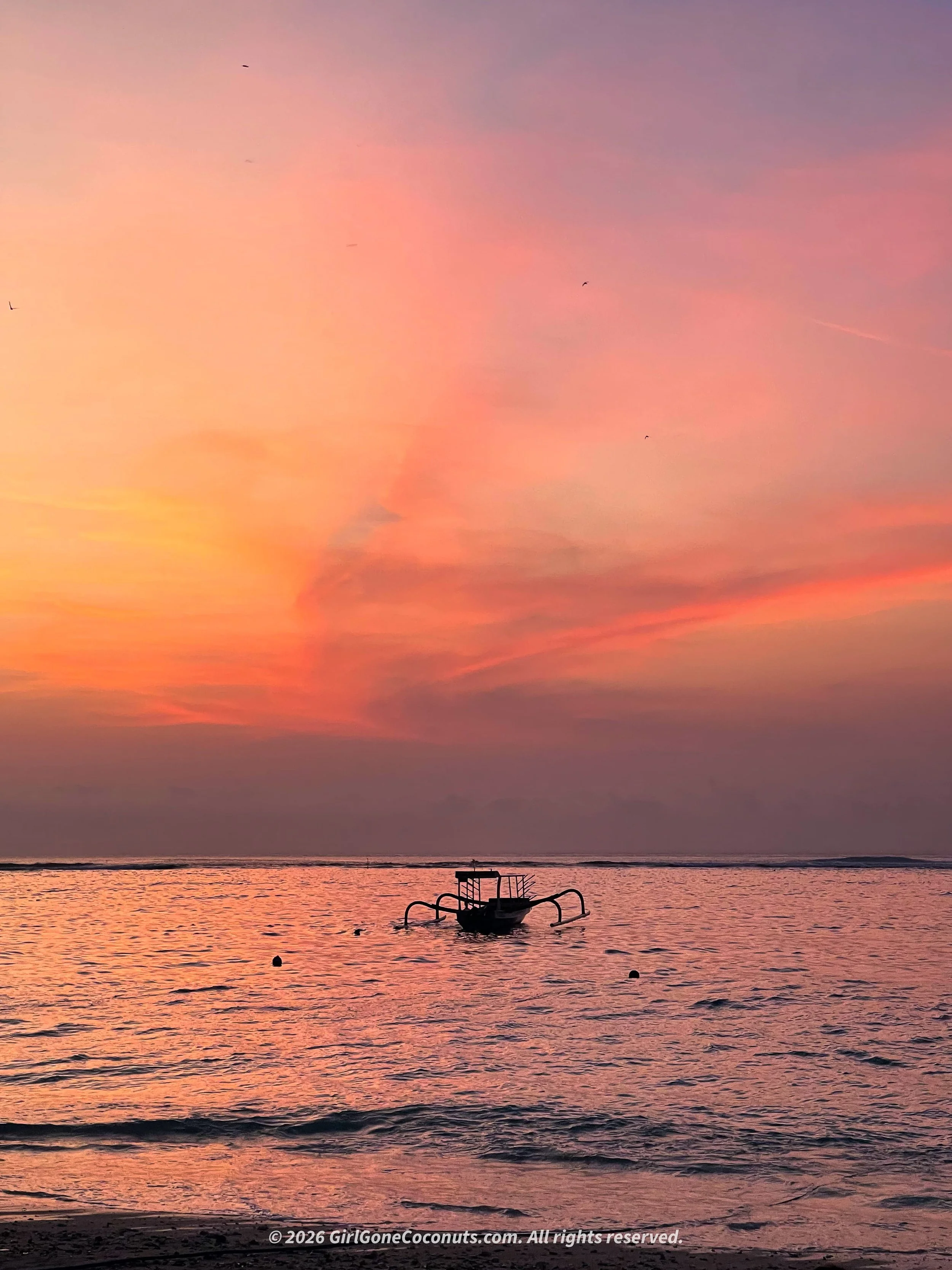 A dreamy pink and purple Nusa Lembongan sunset from Jungutbatu Beach.