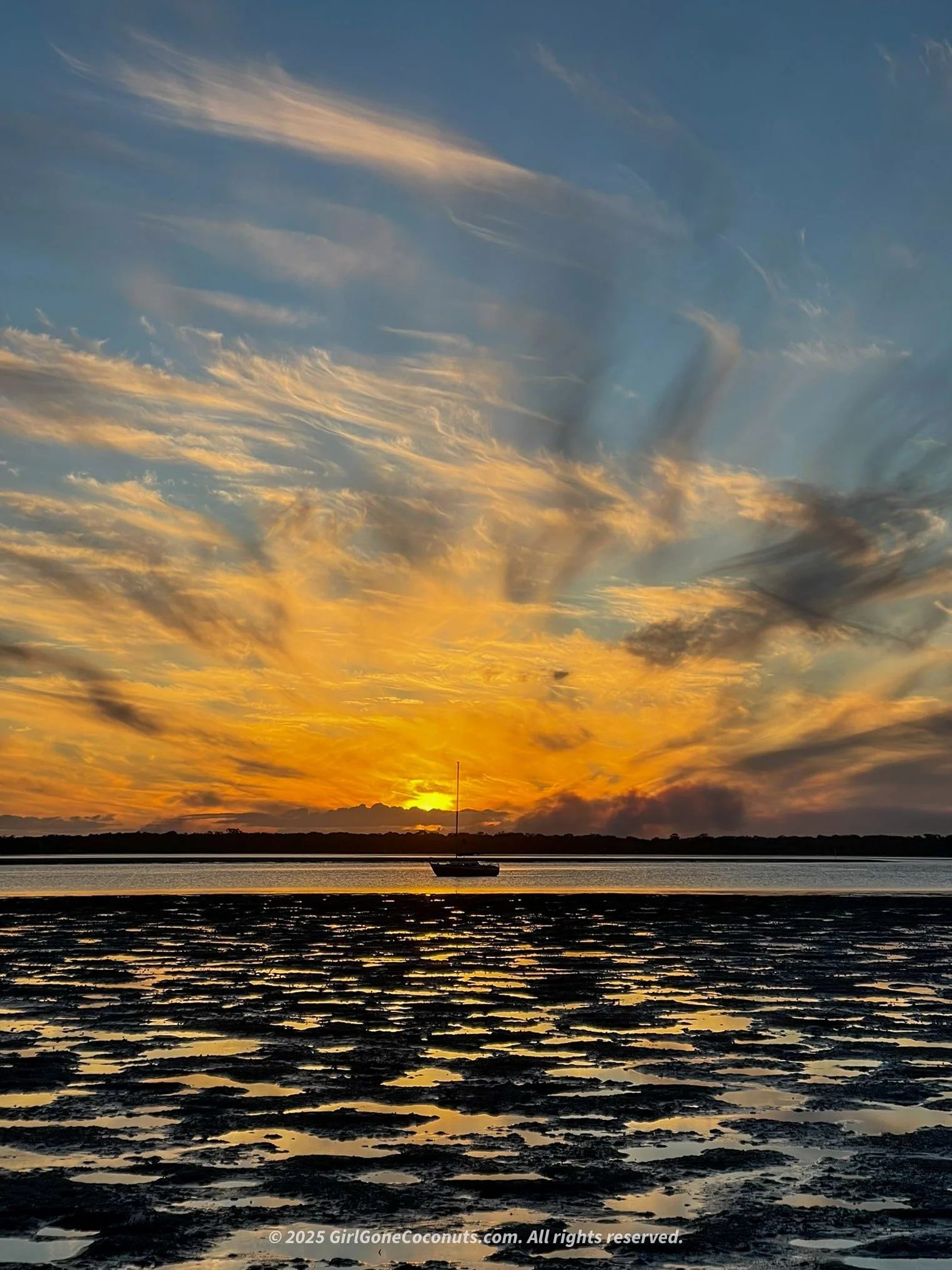 Watching the sun sink over Carlo Point, the perfect Rainbow Beach sunset view.