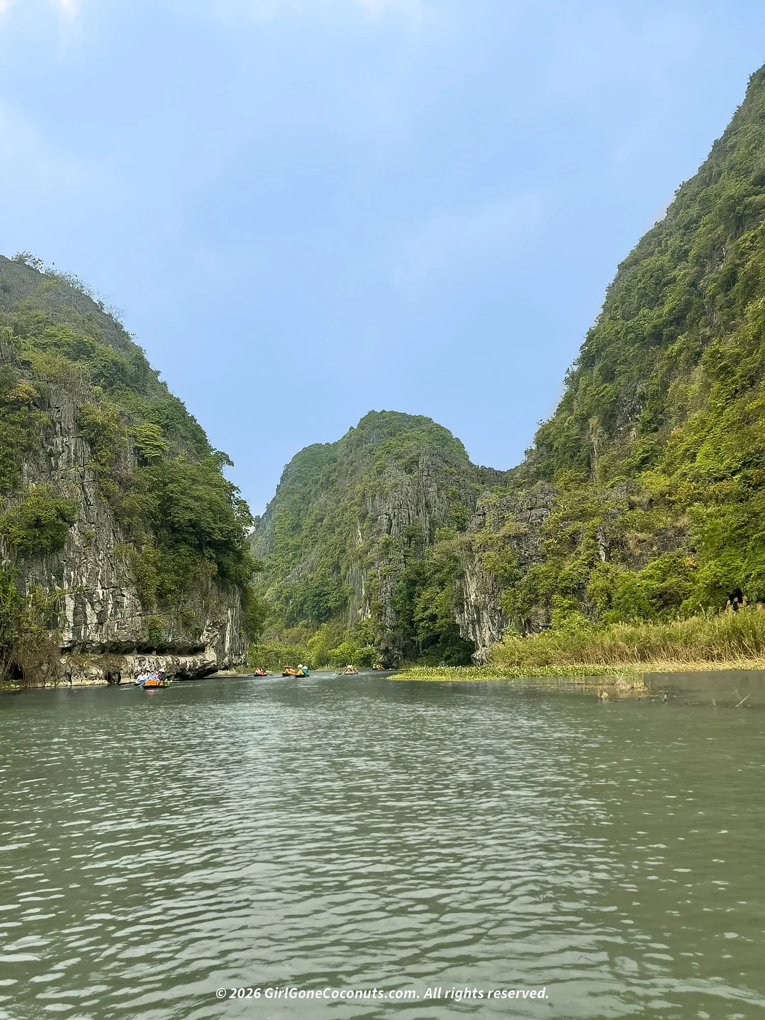 Boat ride along the Tam Coc river through limestone karsts, Ninh Binh Vietnam