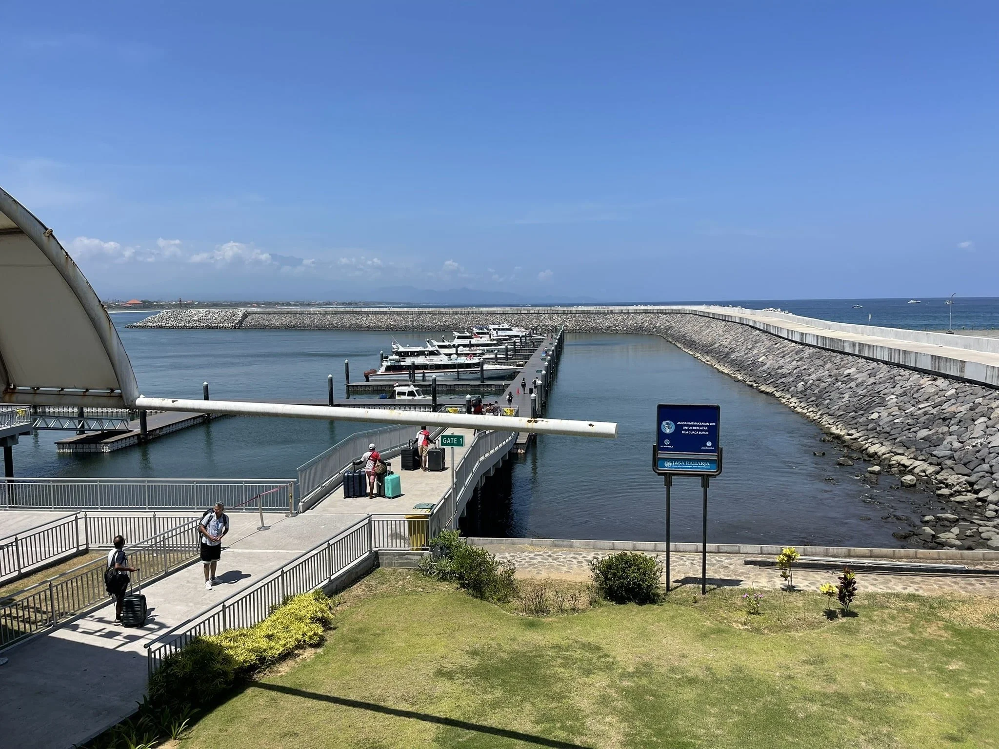 Sanur ferry terminal in Bali with fast boats docked, departure point for Bali to Lombok ferries.