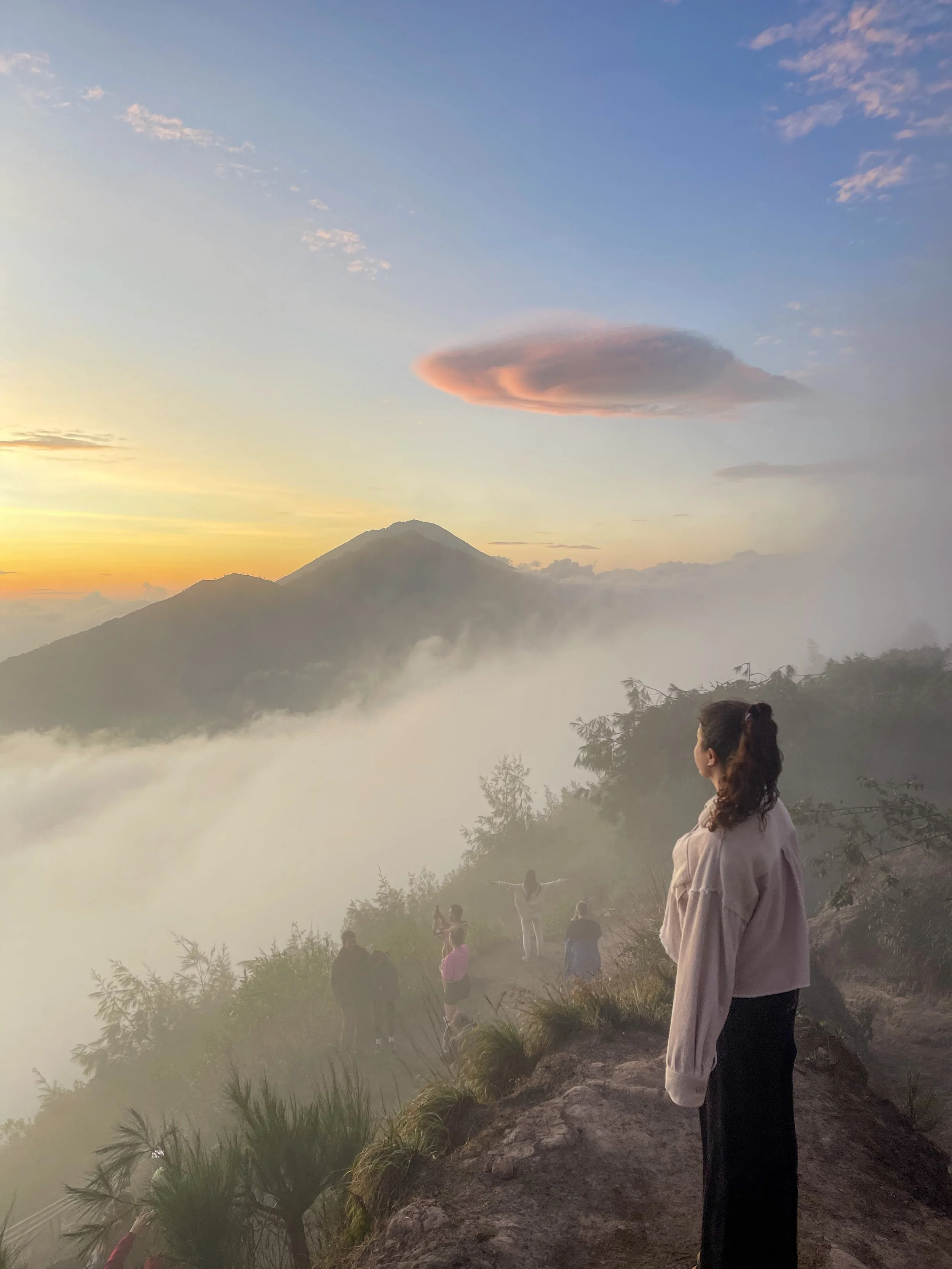 A photo of me during sunrise on my Batur Trek, one of the best things to do in Kintamani, Bali.