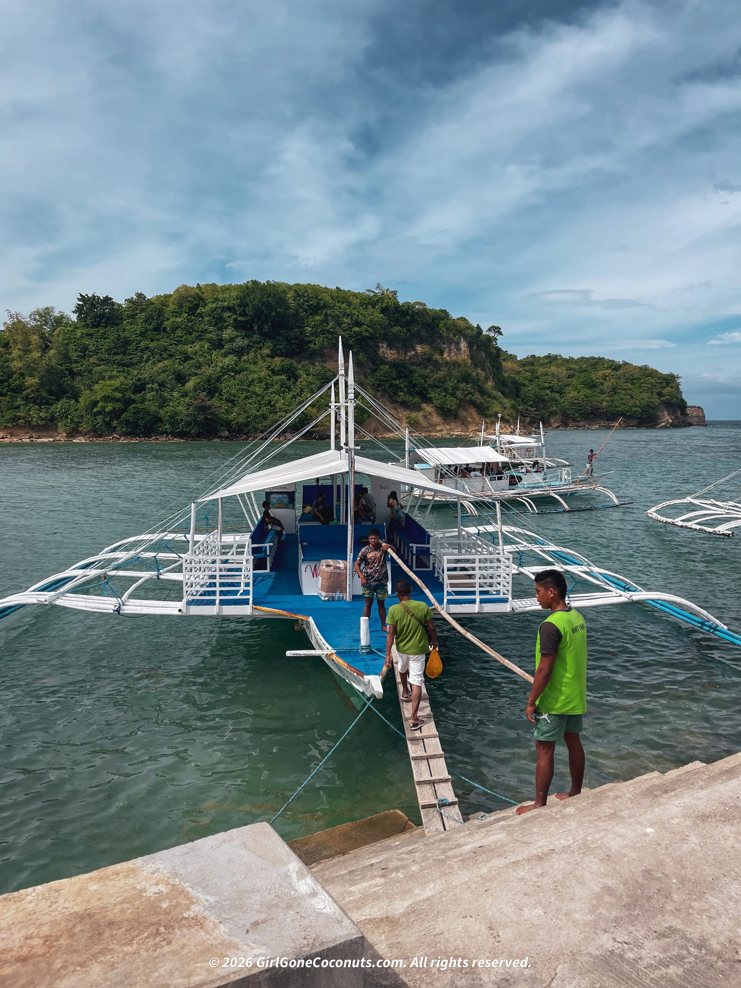 The ferry and the plank used to enter and exit the boat.