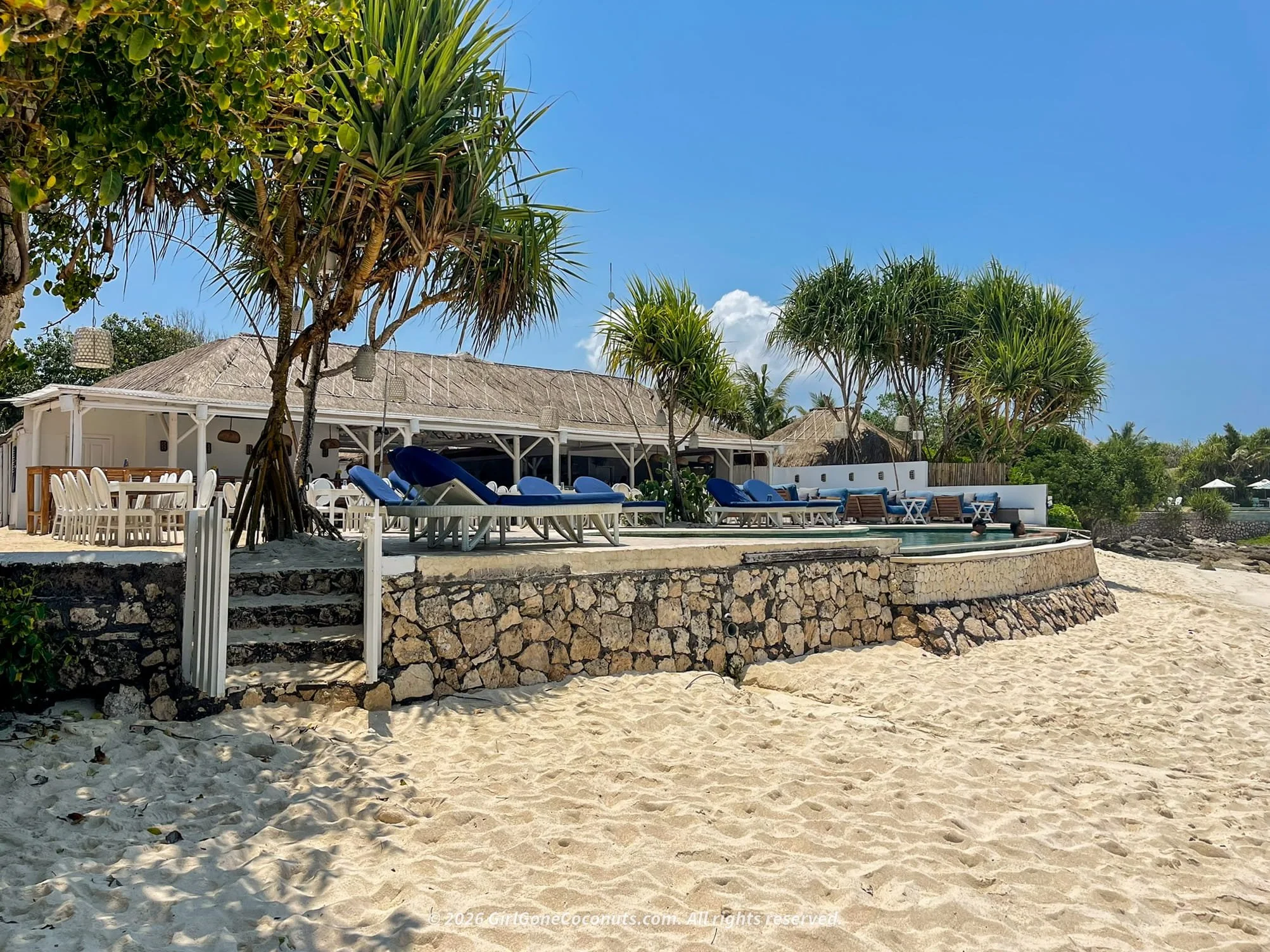 Sandy Bay Beach in Nusa Lembongan with rugged cliffs and blue ocean, one of the best beaches on the island.