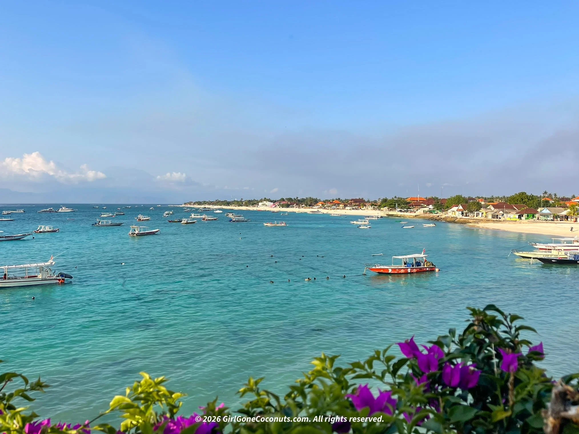 A scenic view over Nusa Lembongan's coastline with Agung in the backdrop.