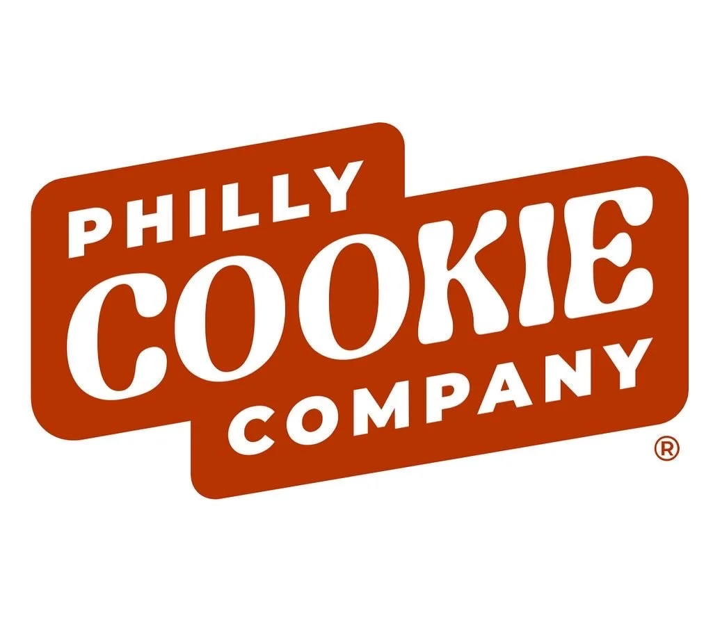 Loc Pham holding a box of Philly Cookie Company cookies.