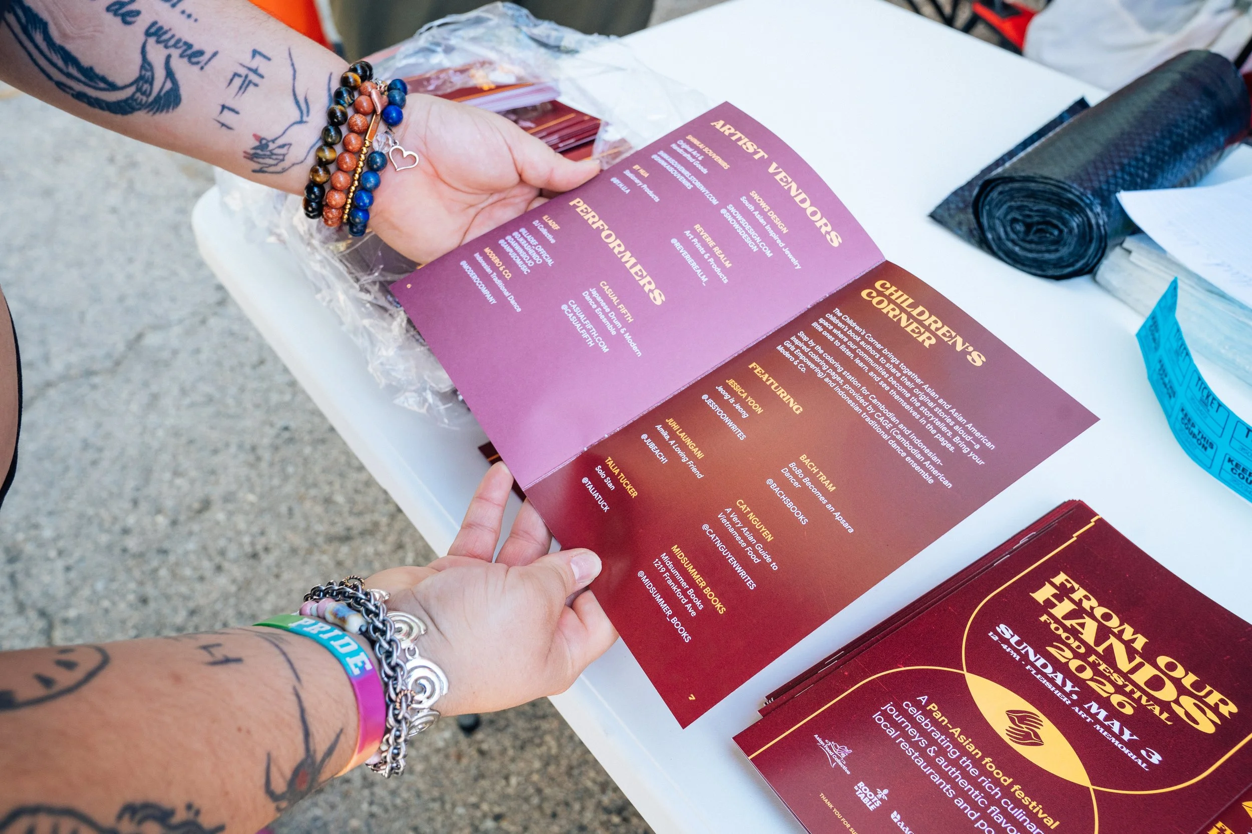 Printed programs for From Our Hands Food Festival 2026. Designed by Jason.