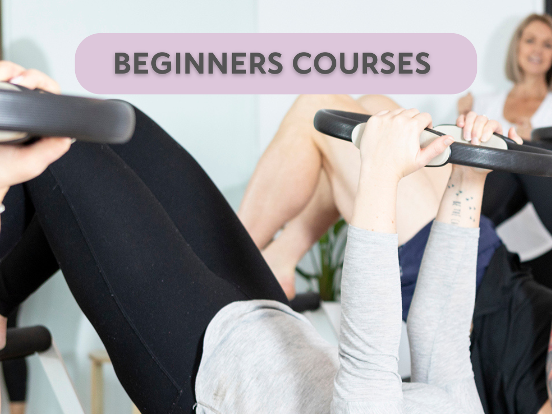 A woman in a blue shirt and glasses is doing a plank exercise on a reformer machine, with a Pilates instructor in a white shirt coaching her, in a fitness studio. Text overlay reads '5 Week Beginners Course!'