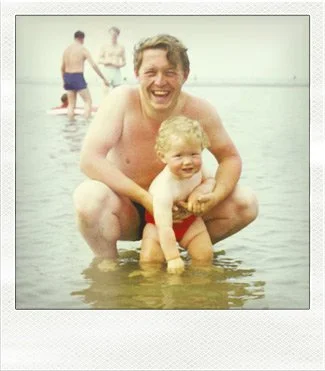Dave Wall of Dave Wall Photo with Dad in ten sea at Abersoch 1960's