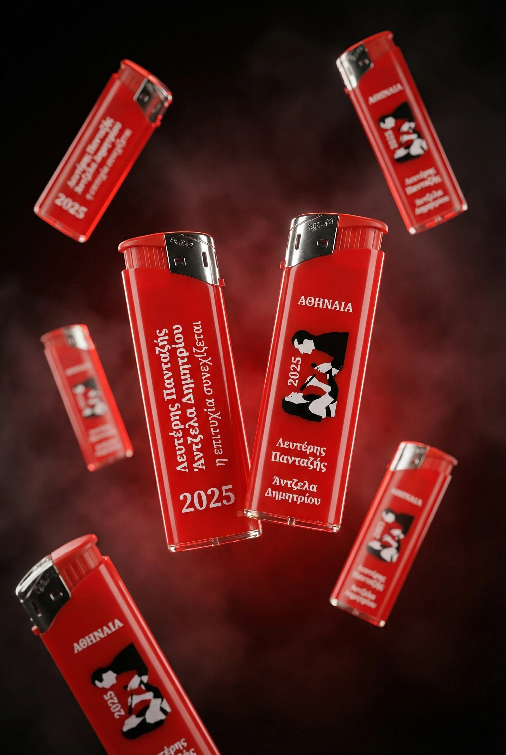 Multiple red lighters with Greek text and illustrations of Λευτέρης Πανταζής, ΛΕΠΑ, Lepa, Lefteris Pantazis, Antzela Dimitriou Αντζελα Δημητρίου at Athinaia Αθηναία, floating against a dark background with red smoke.