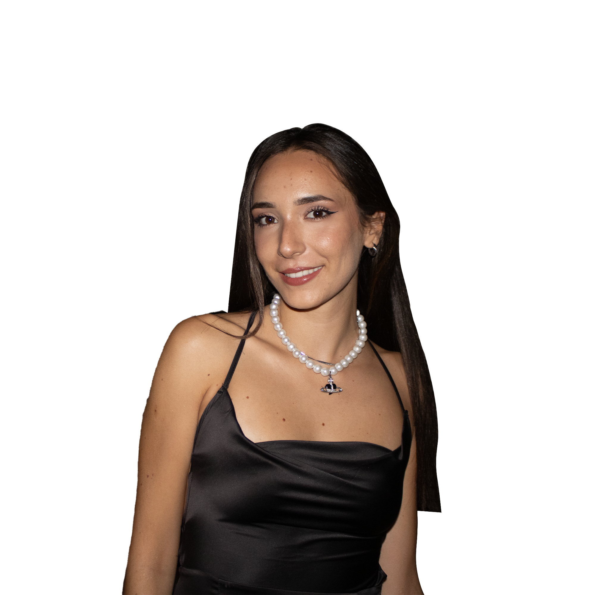 A woman with long dark hair wearing a black satin dress, pearl necklace, and earrings, winking at the camera with a slight smile. Marina Koja