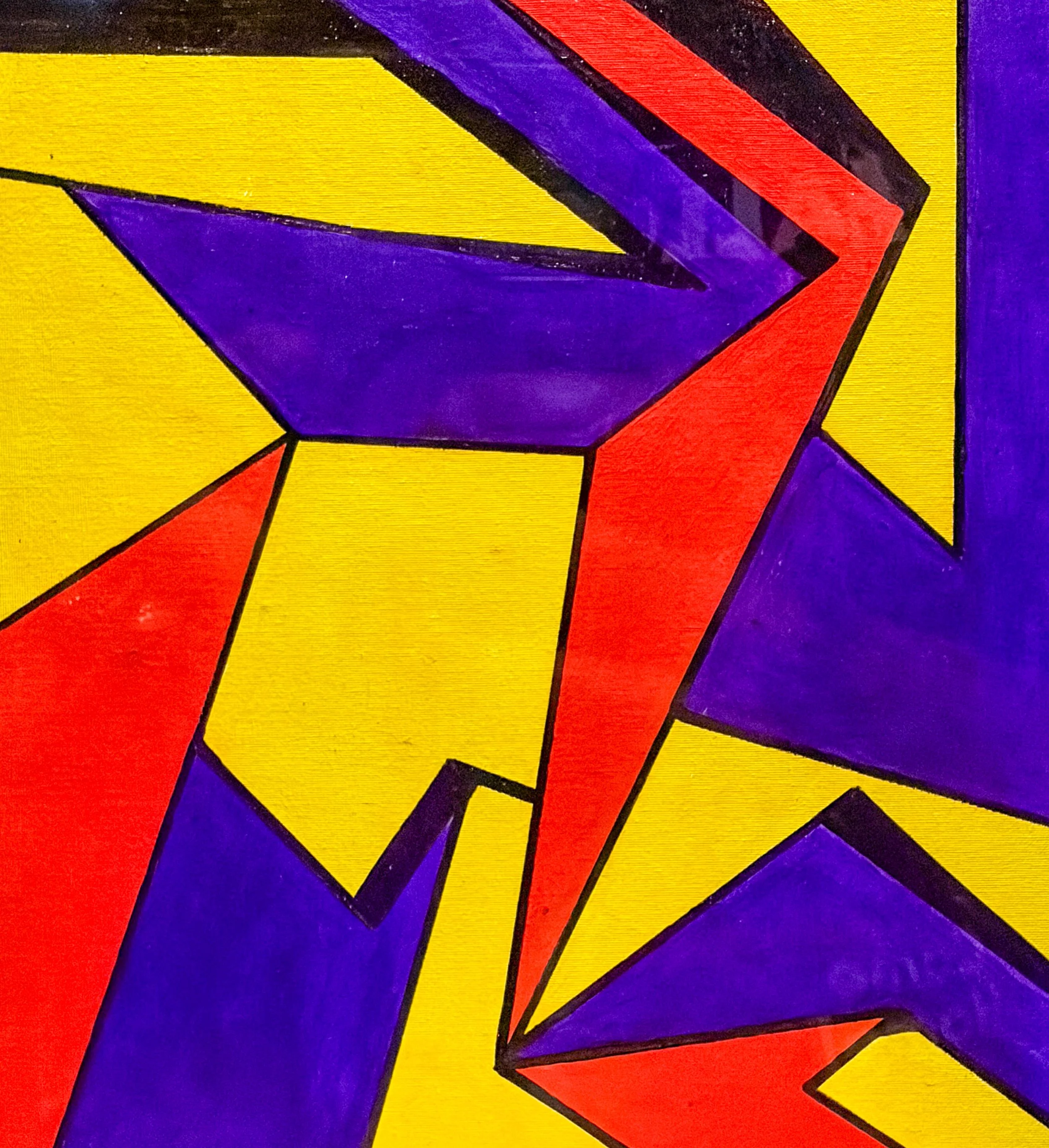 Close-up of the Superman logo with red, blue, purple, and yellow colors in an abstract, geometric design.