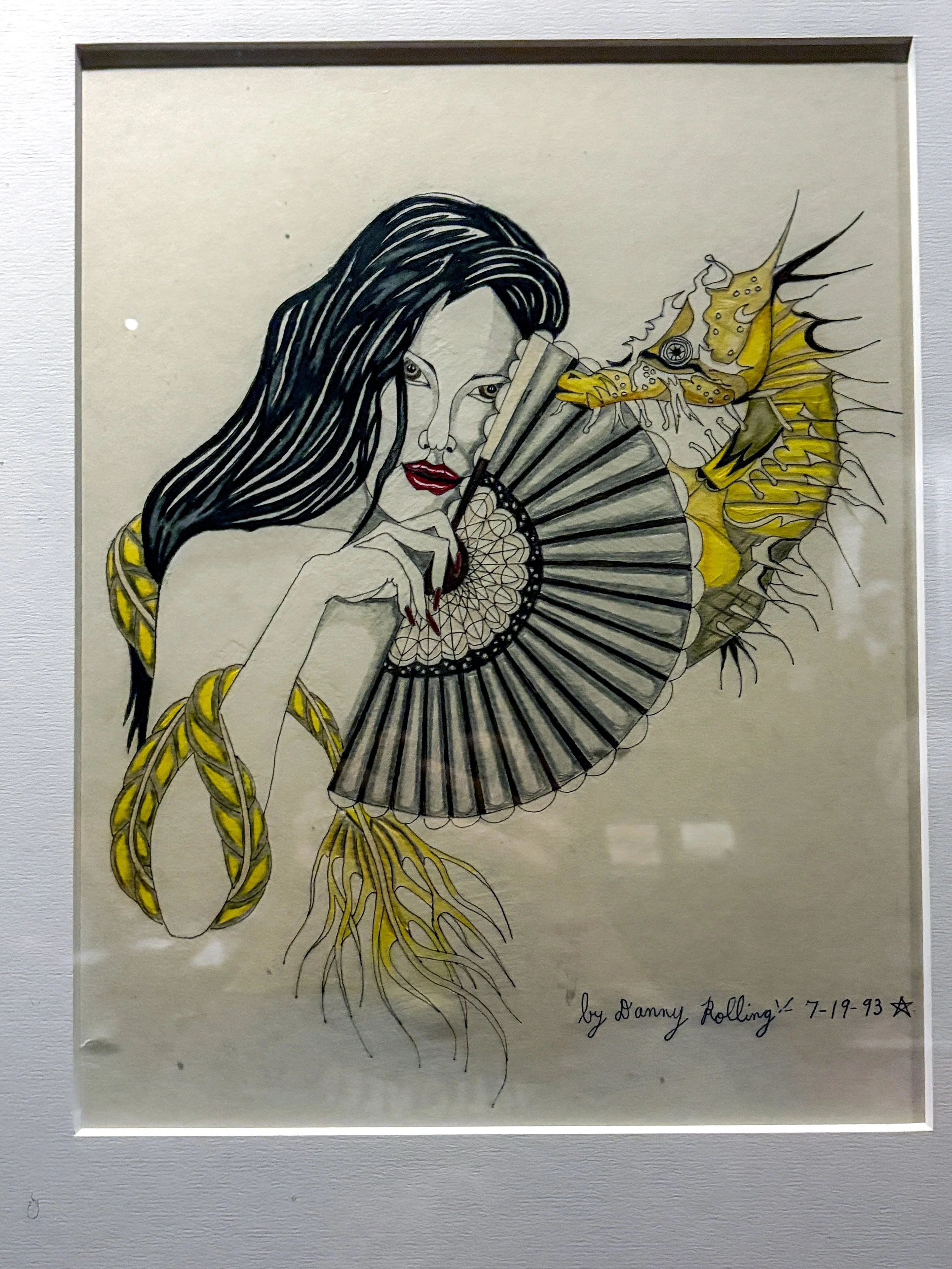 A detailed illustration of a woman with long black hair holding a fan and a fish with a yellow and black body and spines, blending human and fantasy elements. Signed by Danny Rolling, dated 7-19-93.