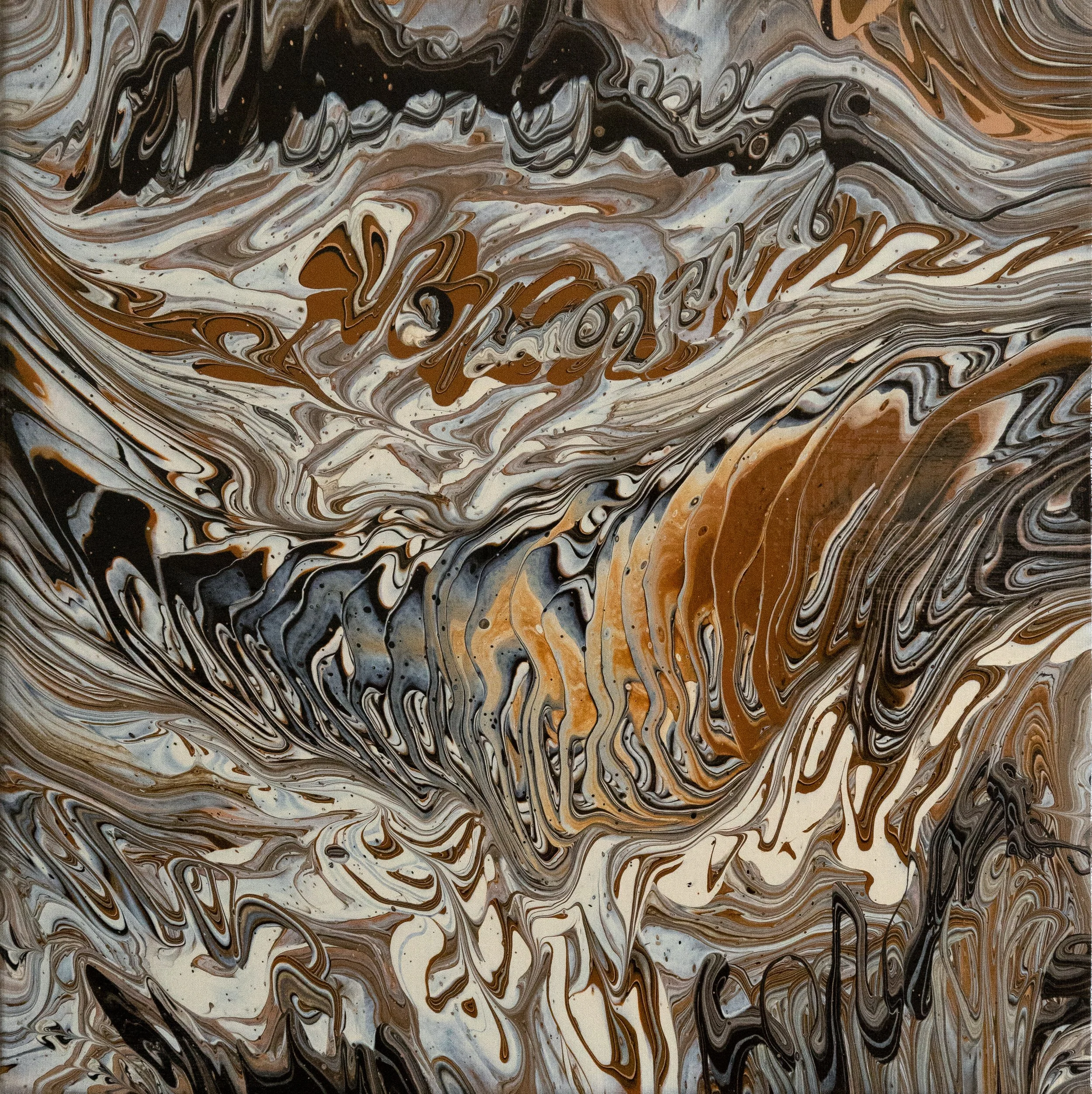 Marbled abstract background with swirls of black, brown, gray, beige, and white colors.