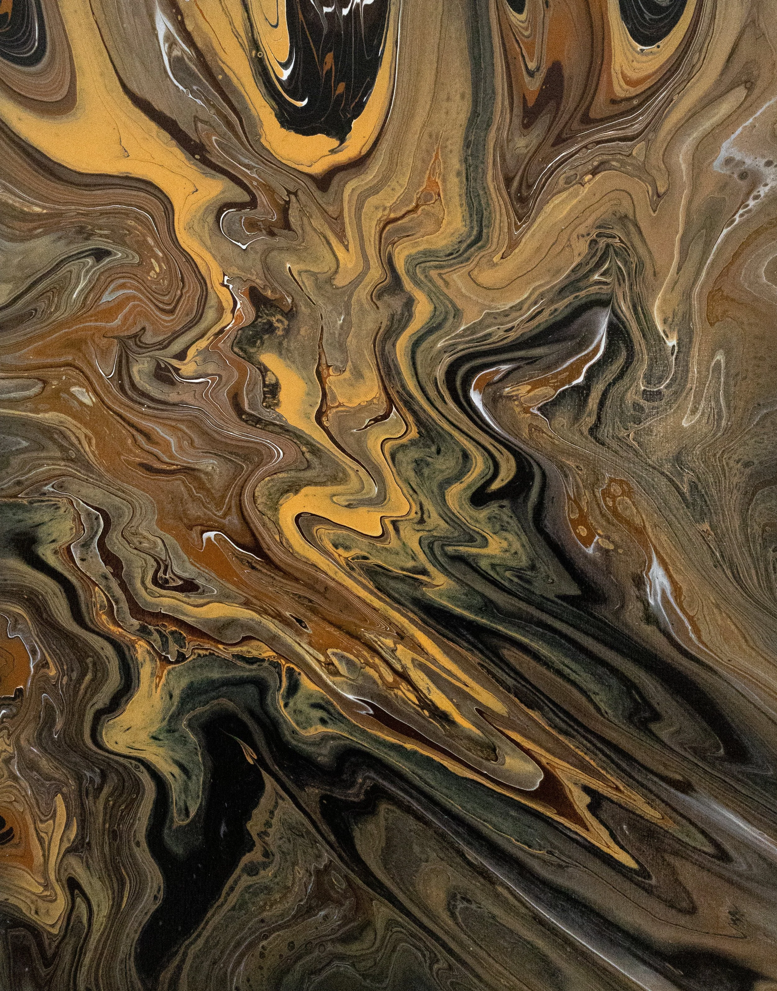 Abstract swirling pattern of black, brown, gold, and beige colors, resembling marbled or fluid art.