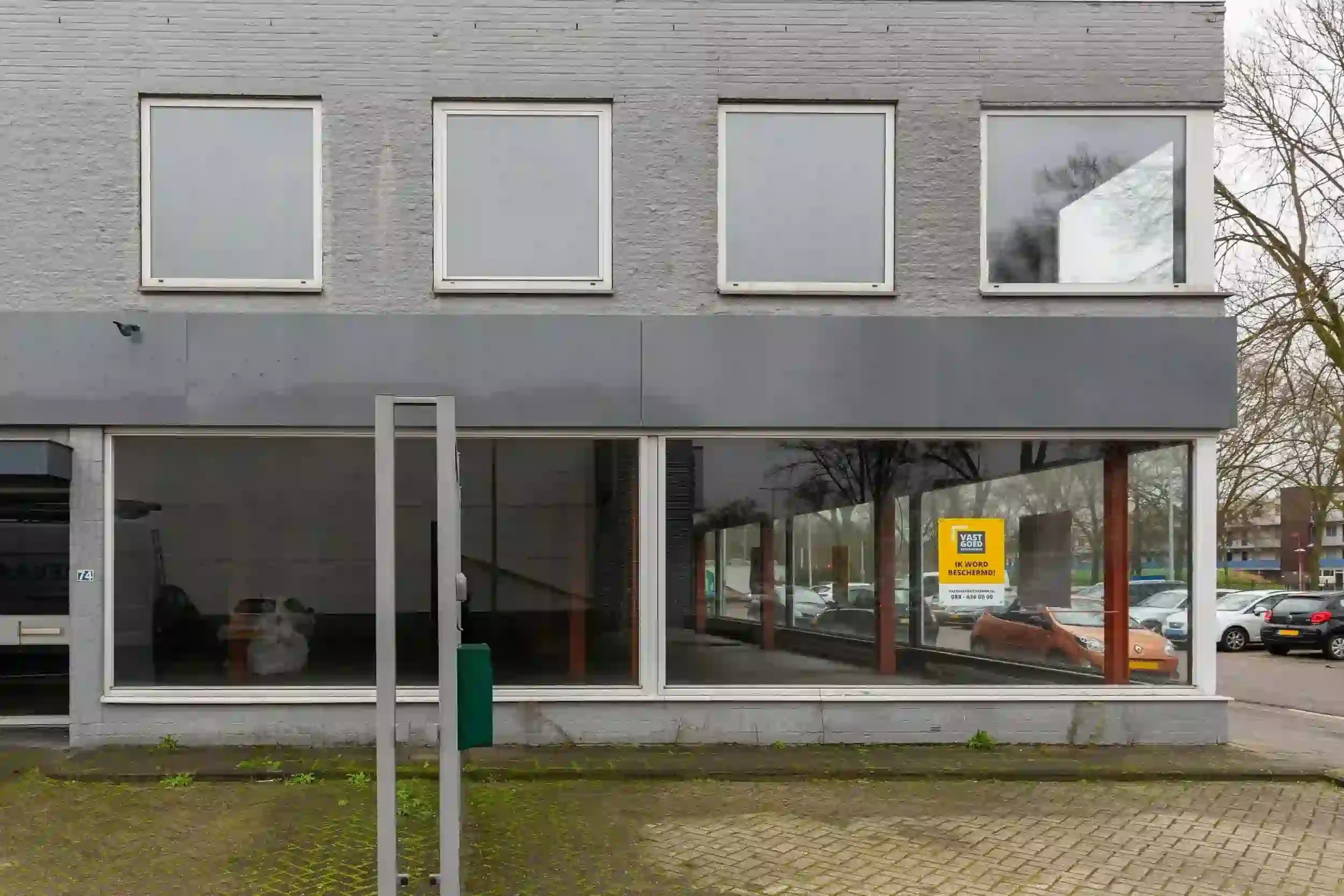 Vacant, decaying commercial building front view