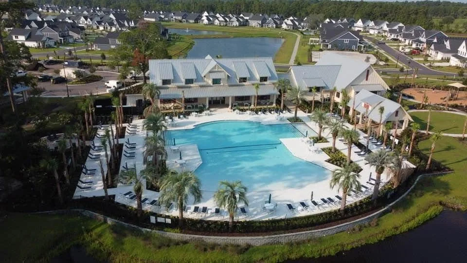 Aerial view of the resort style pool and clubhouse at the Grand Dunes North amenity center