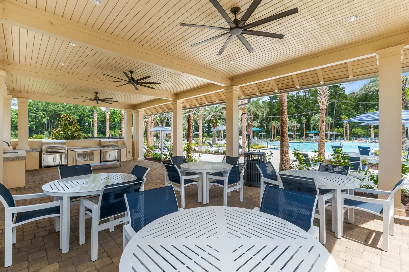 Covered outdoor dining and grill pavilion at Grande Dunes North Amenity Center
