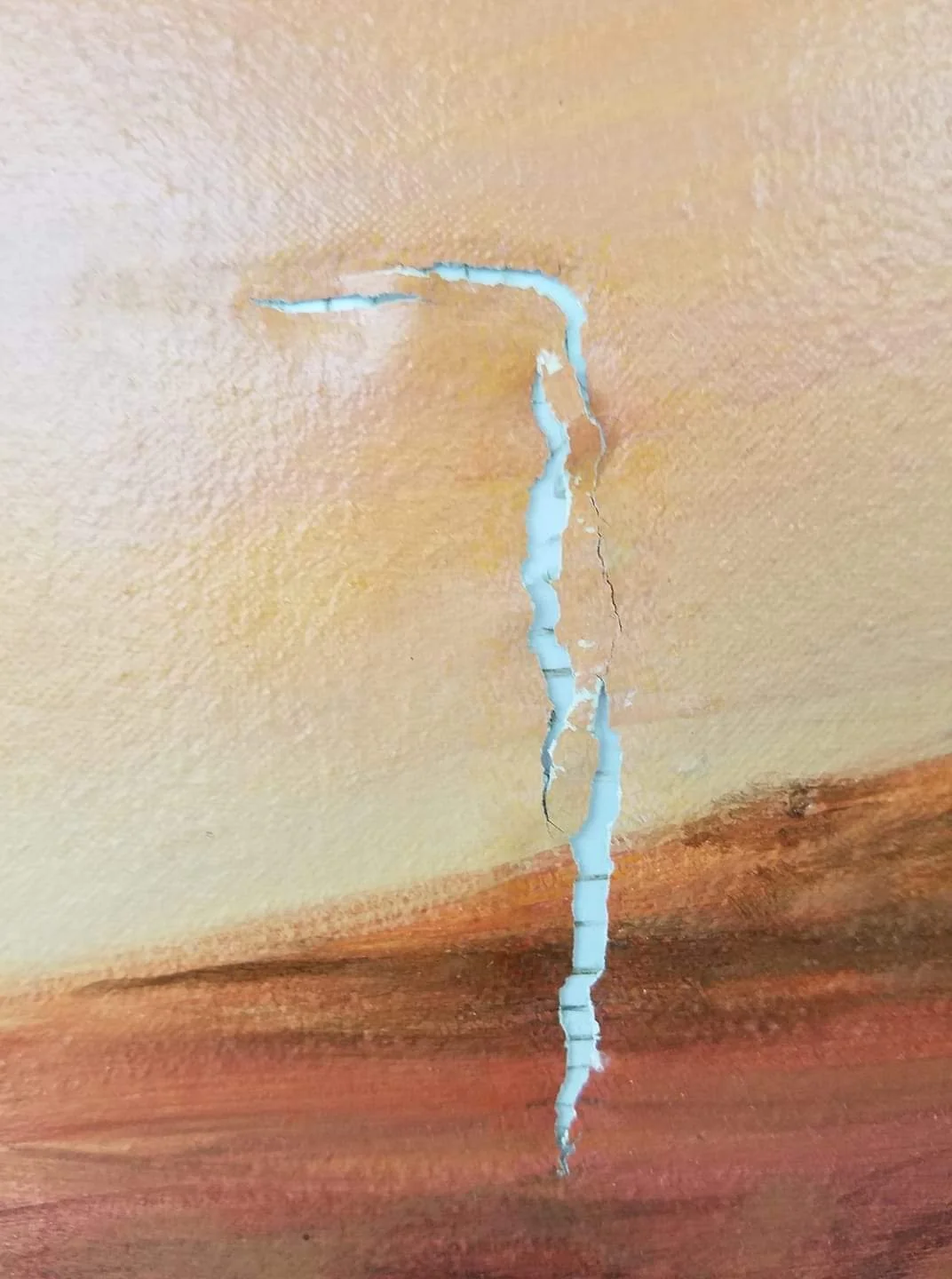 Example of a gapped tear, painting conservation