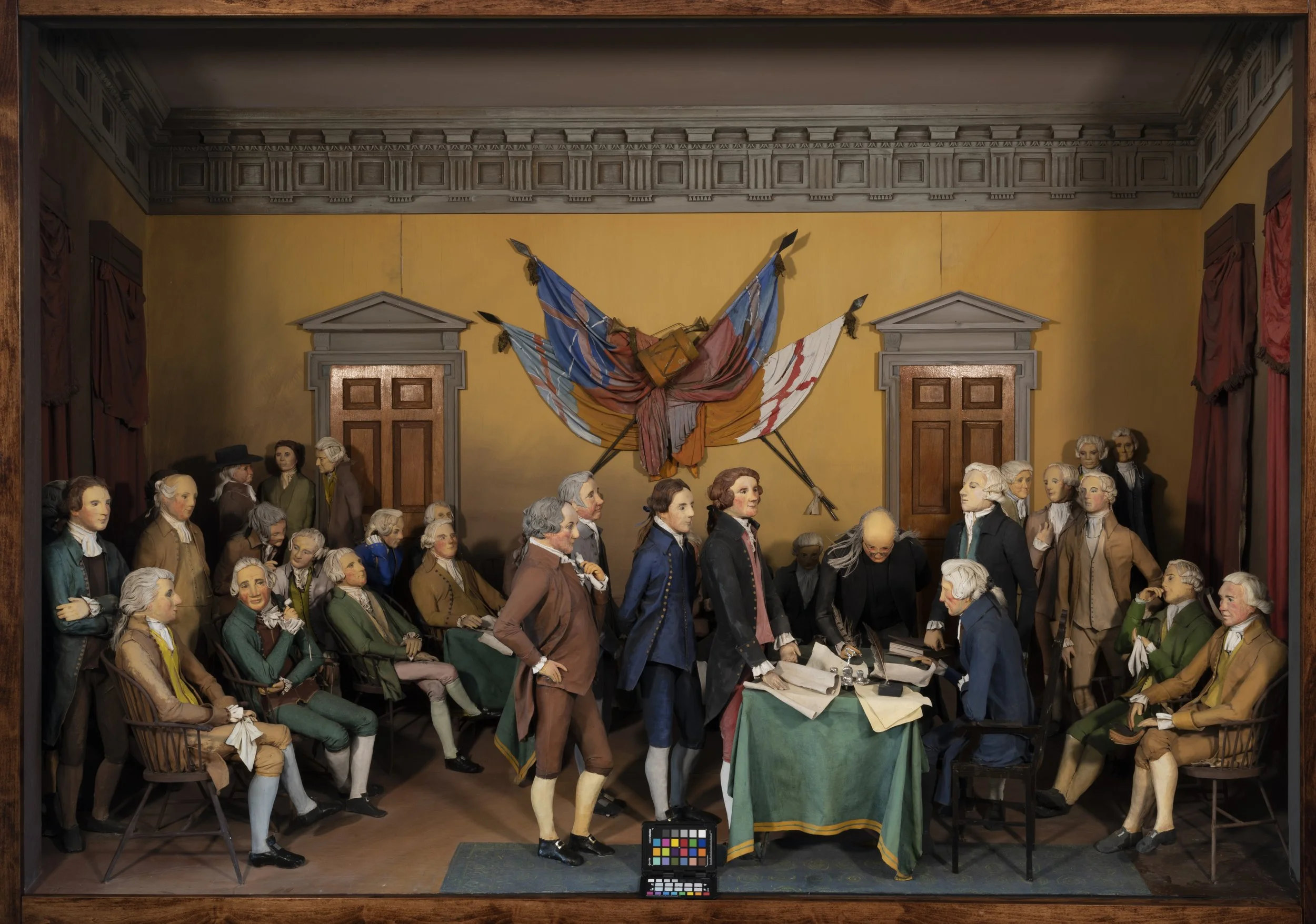 diorama featuring Founding Fathers signing the Declaration of Independence after treatment