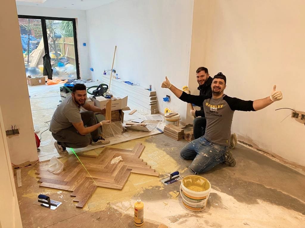 The team at New End Construction laying parquet floor