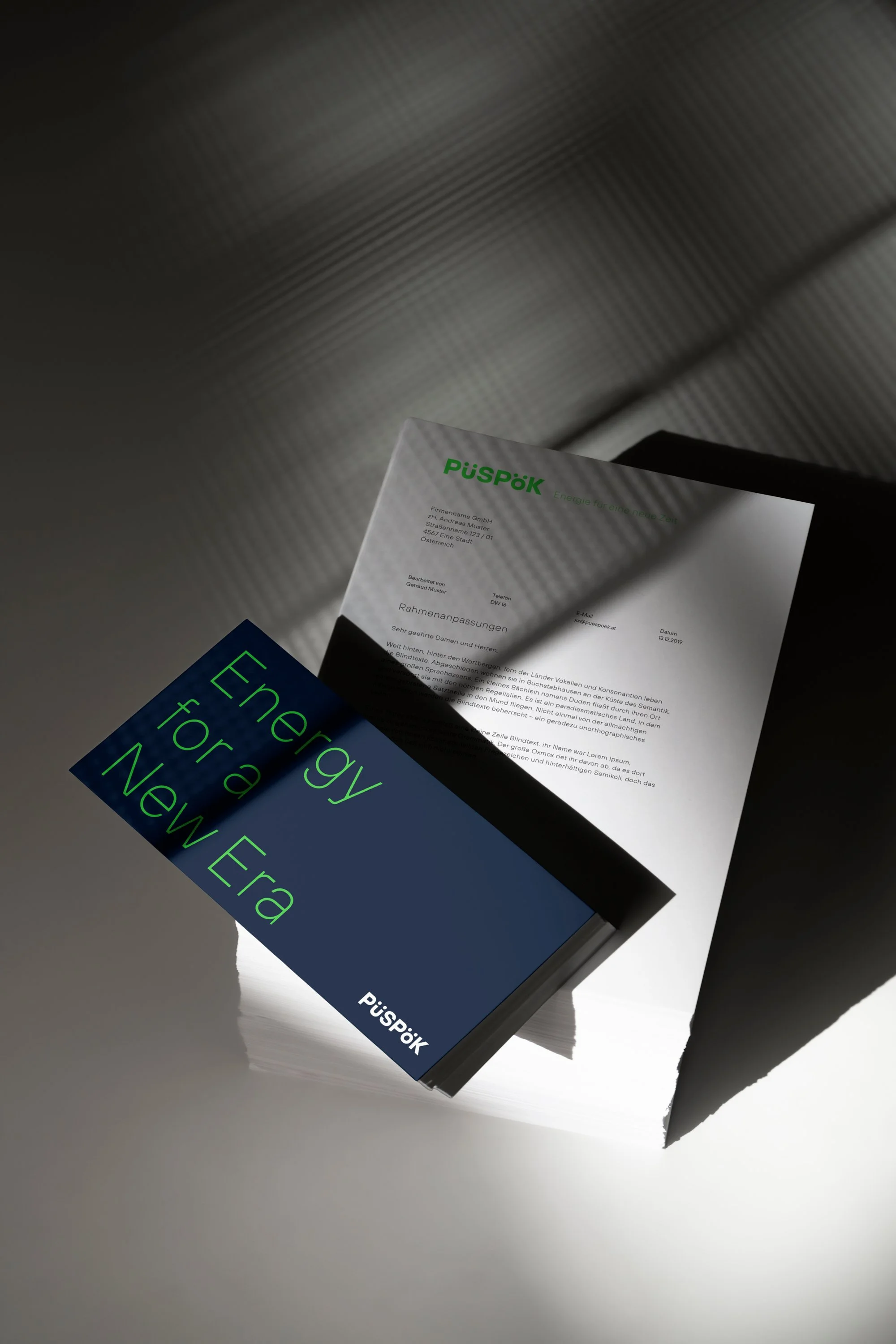 Card or Envelope showing a slogan Energy for a new era laying on a pile of branded letters from Puespoek