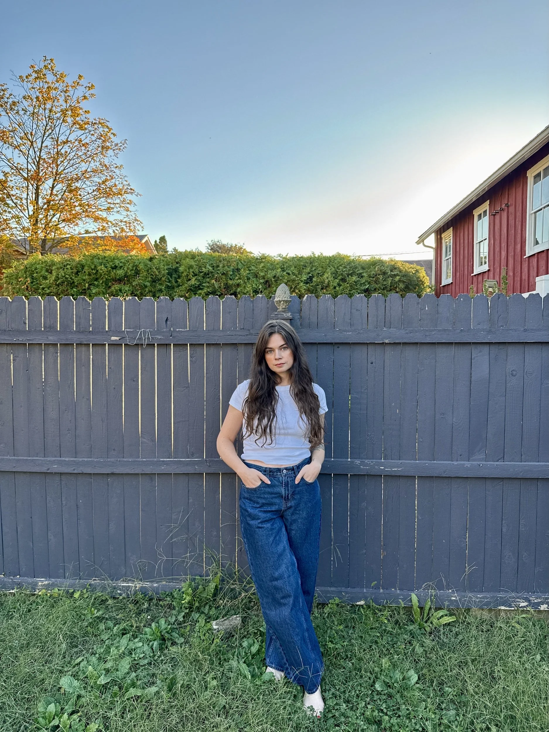 Photo of Rachel Reeher, author of Queen of Bats: And Other Stories, in the backyard of her home in Mifflinburg, PA.