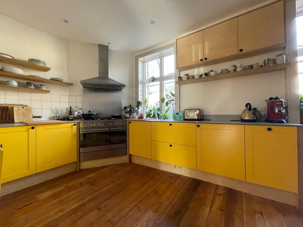Yellow plywood kitchen