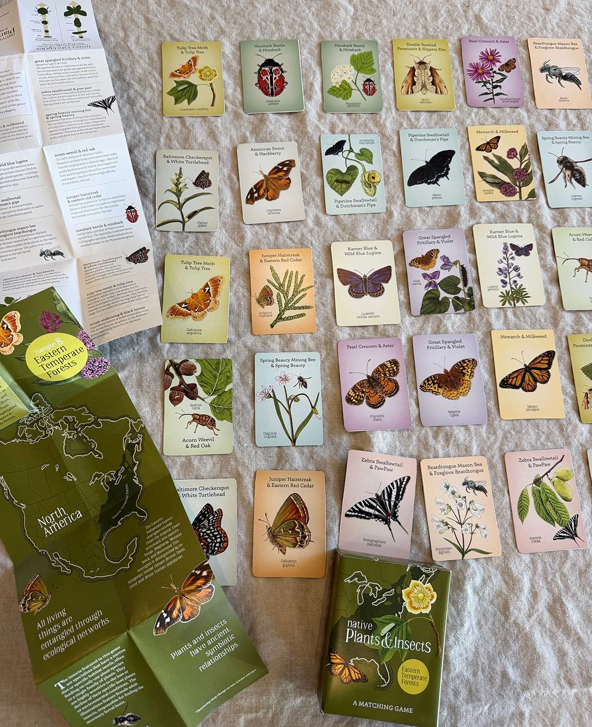 Game components include cards, insert map, and game box