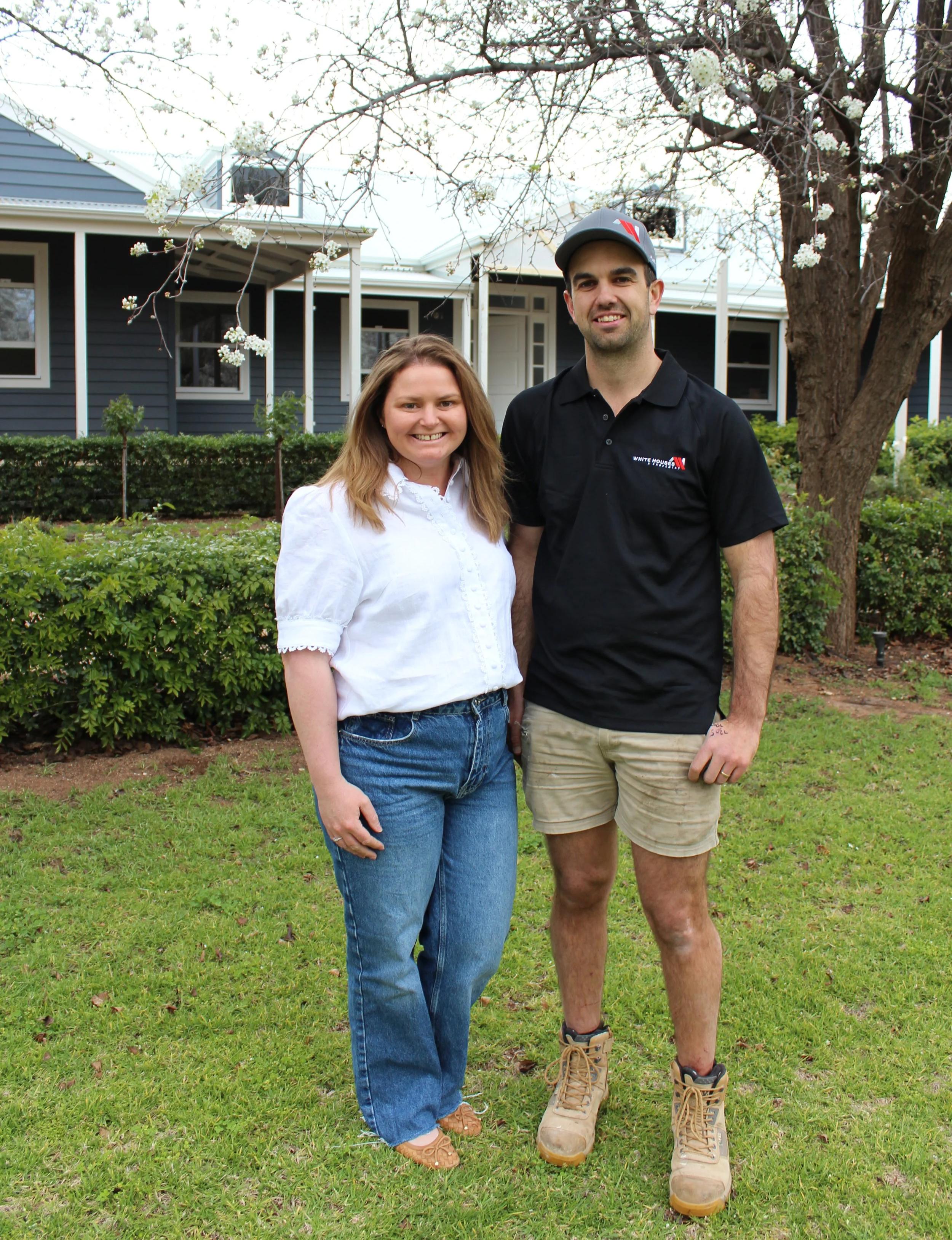 Custom home builders standing at custom renovation project.