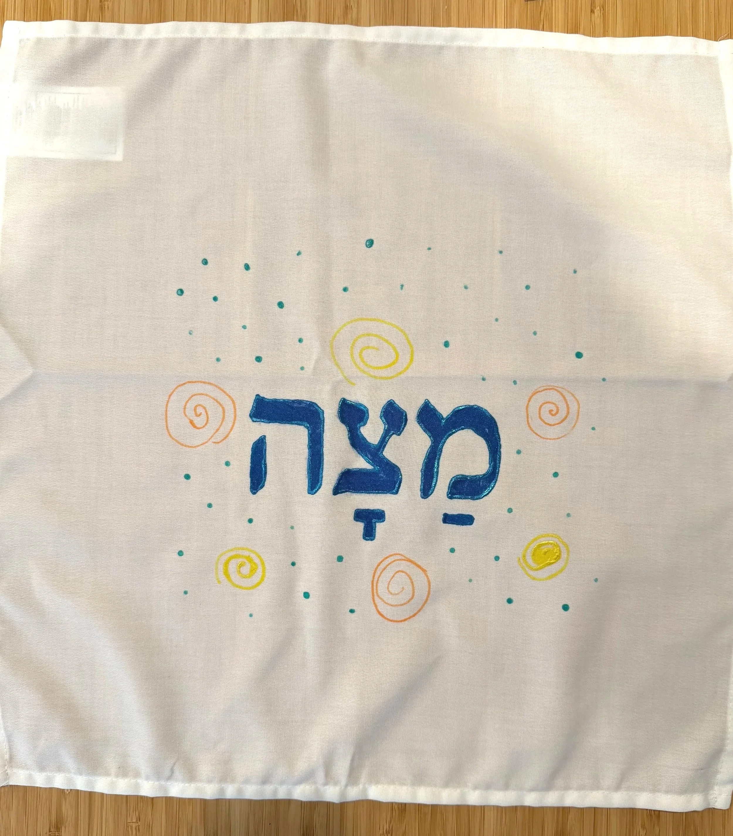Creating a matzah (or challah) cover is a great use of a cloth napkin and some fabric marker!