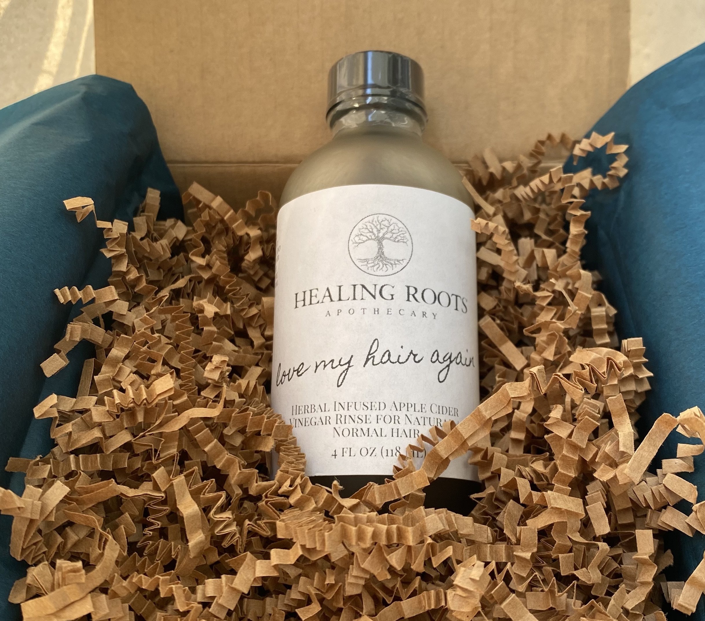Rinses are delicately nestled in natural brown crinkle spring paper for safe shipping to its final destination.
