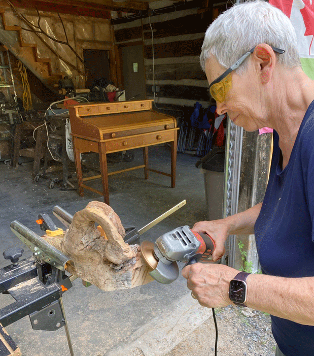 Gloria working on an art piece