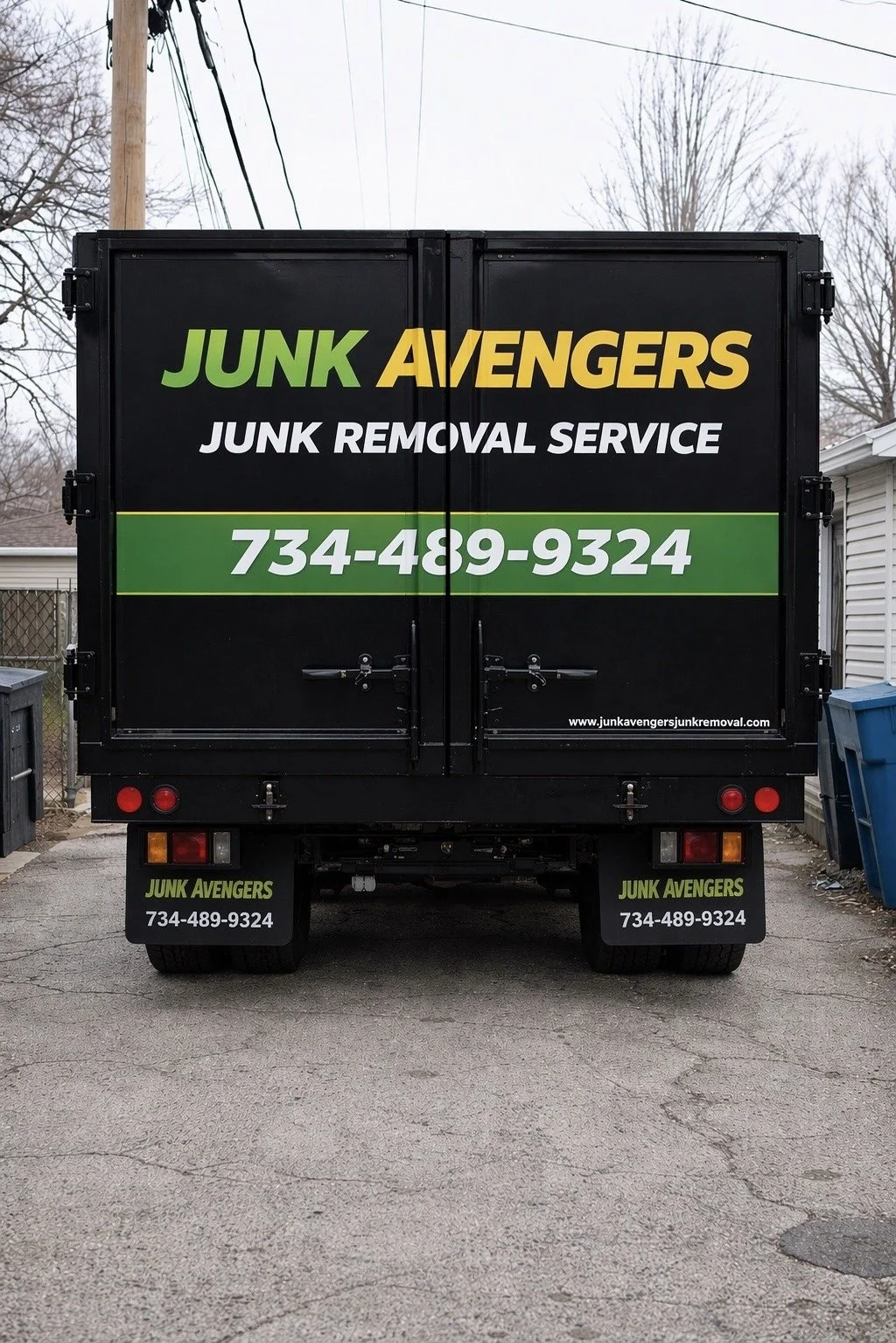 Junk Avengers junk removal truck in alley