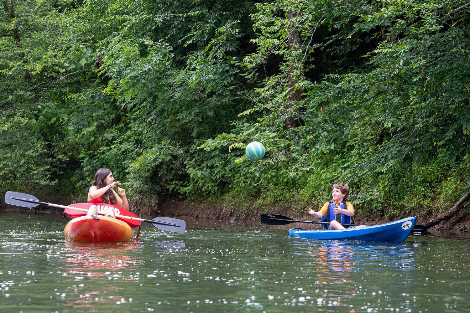 At CBI Camp: Journeys, a summer camp in Charlottesville, Virginia, kids  play catch while kayaking in the river