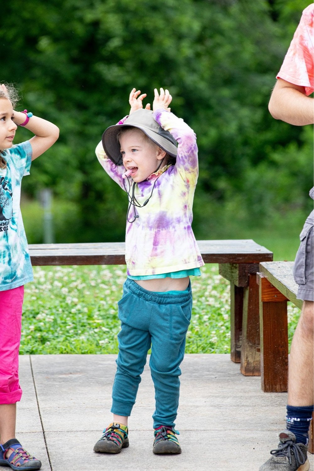 At CBI Camp: Journeys, a summer camp in Charlottesville, Virginia, a younger camper has silly moment during a song with movements wiggling fingers on his head