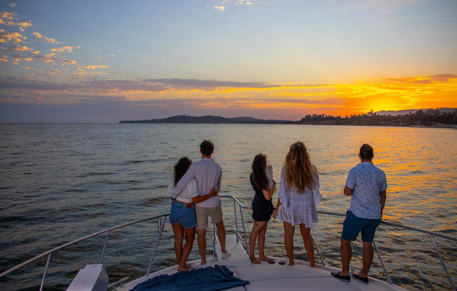 Family and Friends of all ages enjoy a scenic sunset of the Santa Barbara coastline on M Group Private Yacht