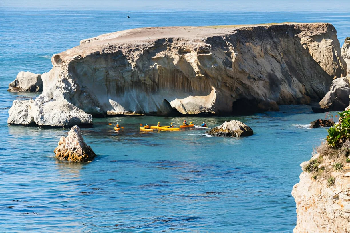 Group of kayakers with M Group Yachts exploring the coastal coves of the Channel Islands