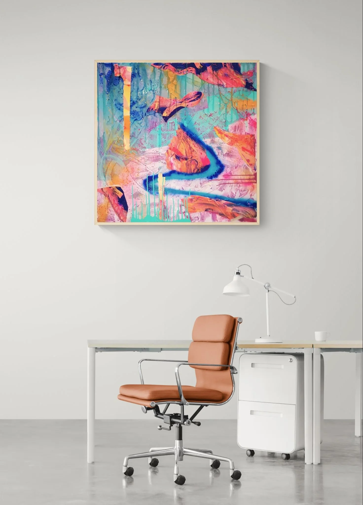 Modern minimalist office space with a white desk, brown leather ergonomic office chair, white mobile file cabinet, white desk lamp, and colorful abstract painting on the wall.
